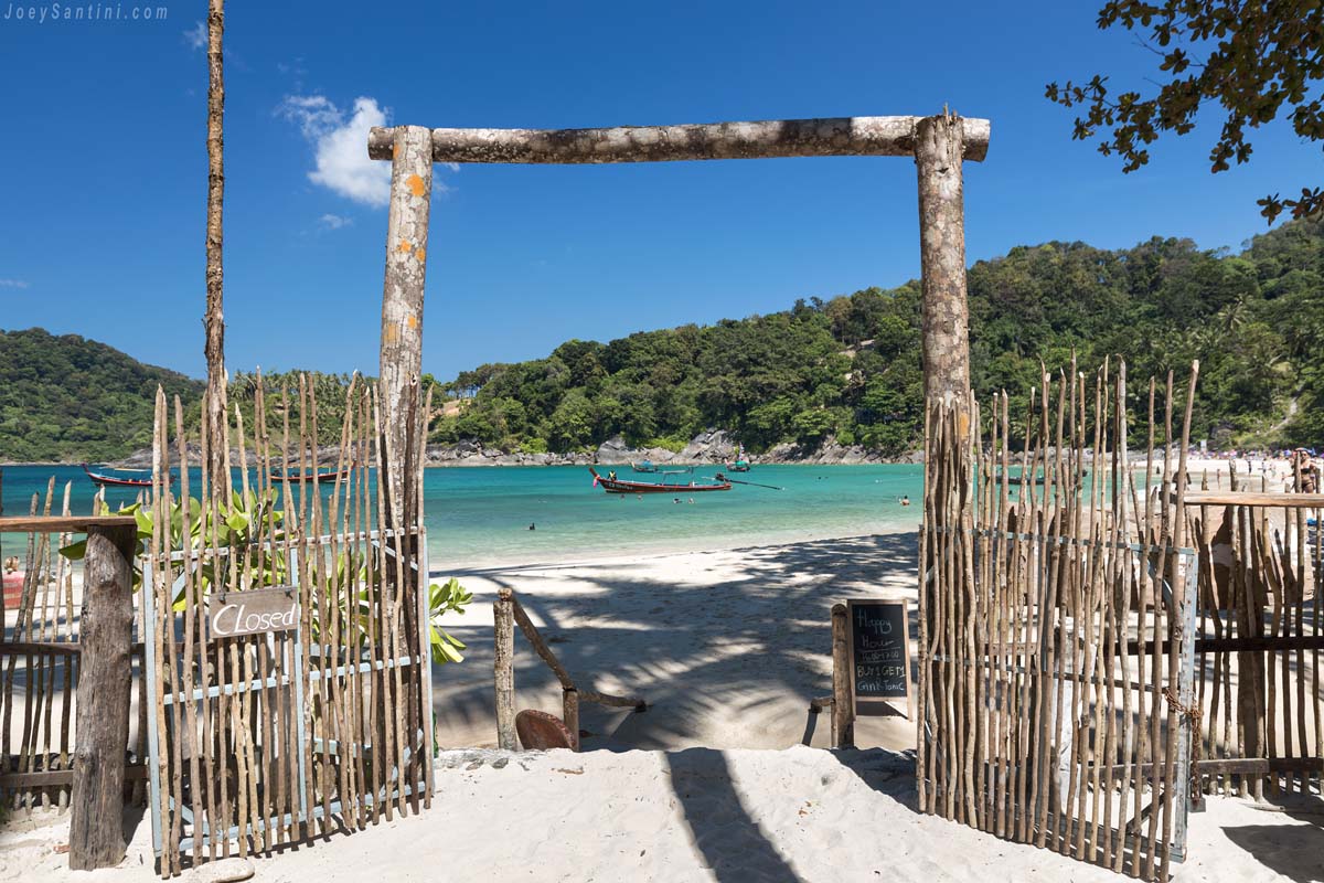 The wooden entrance with the view of the beach
