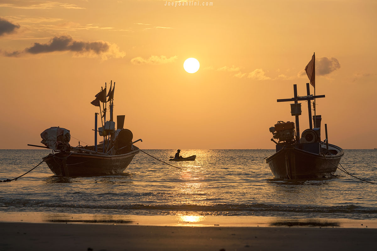Thai boats with a golden sunset