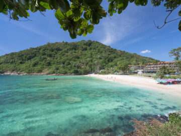 Quiet sandy shore and clear water at Merlin Beach