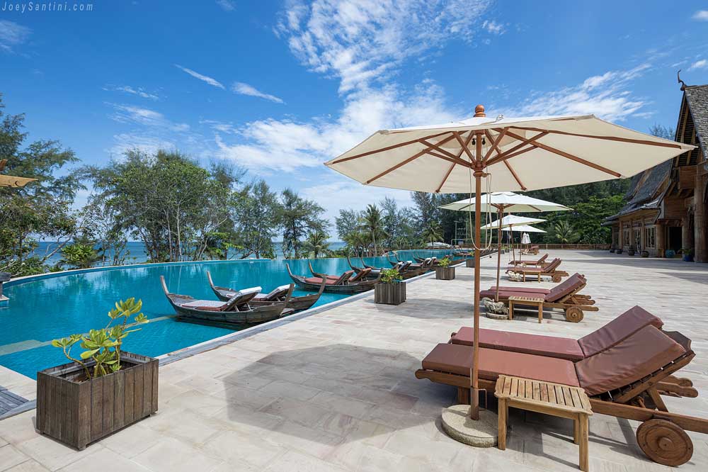 The infinity pool with loungers and umbrellas