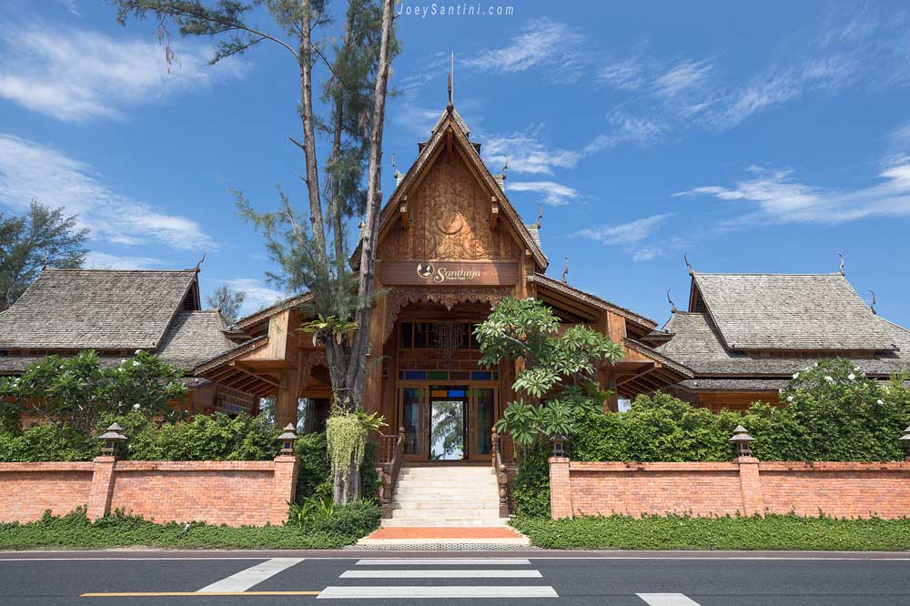 Teak house of Santhiya Phuket Natai during a beautiful day