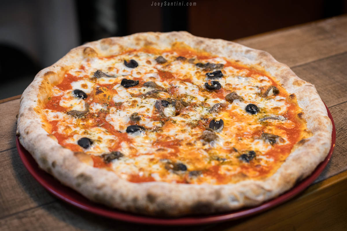 Pizza with black olive and cheese