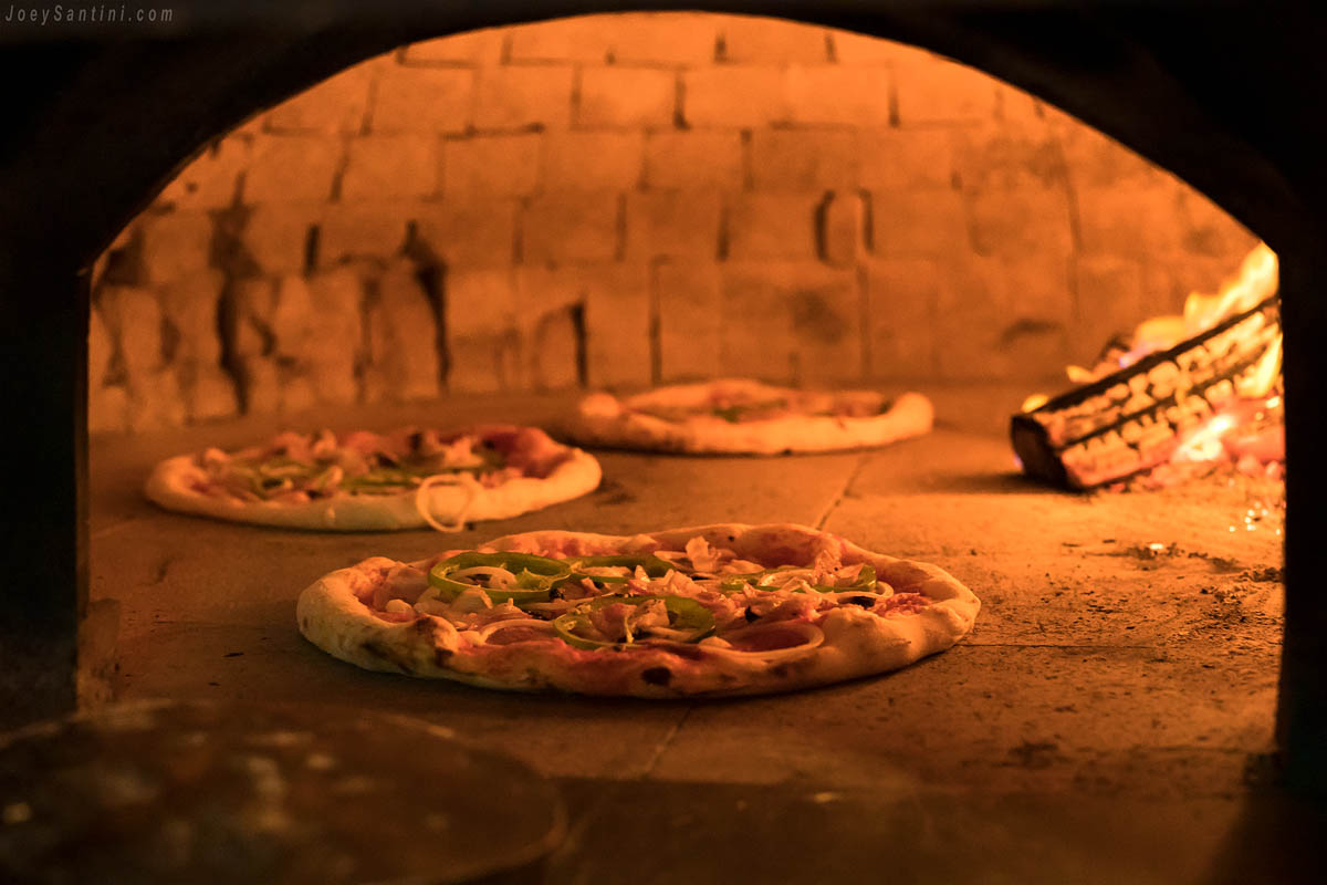 Pizzas inside the wood oven