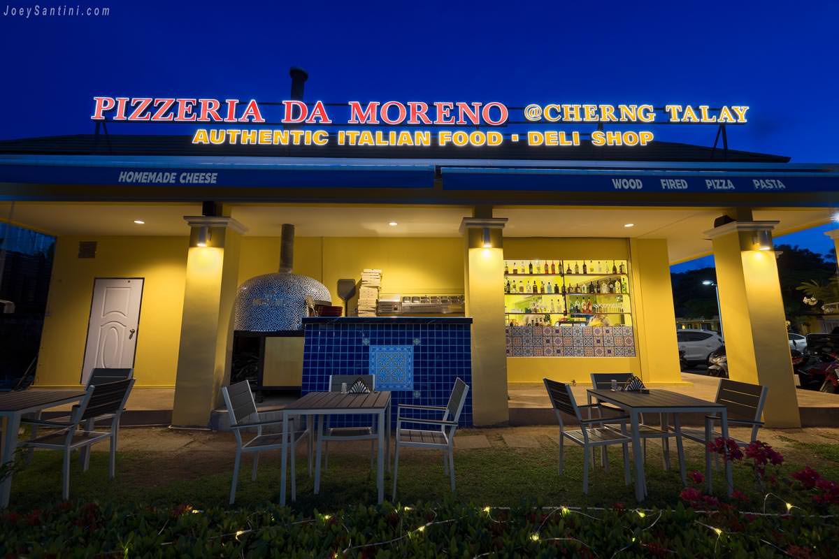 Yellow wall of the restaurant and the sign light switched on
