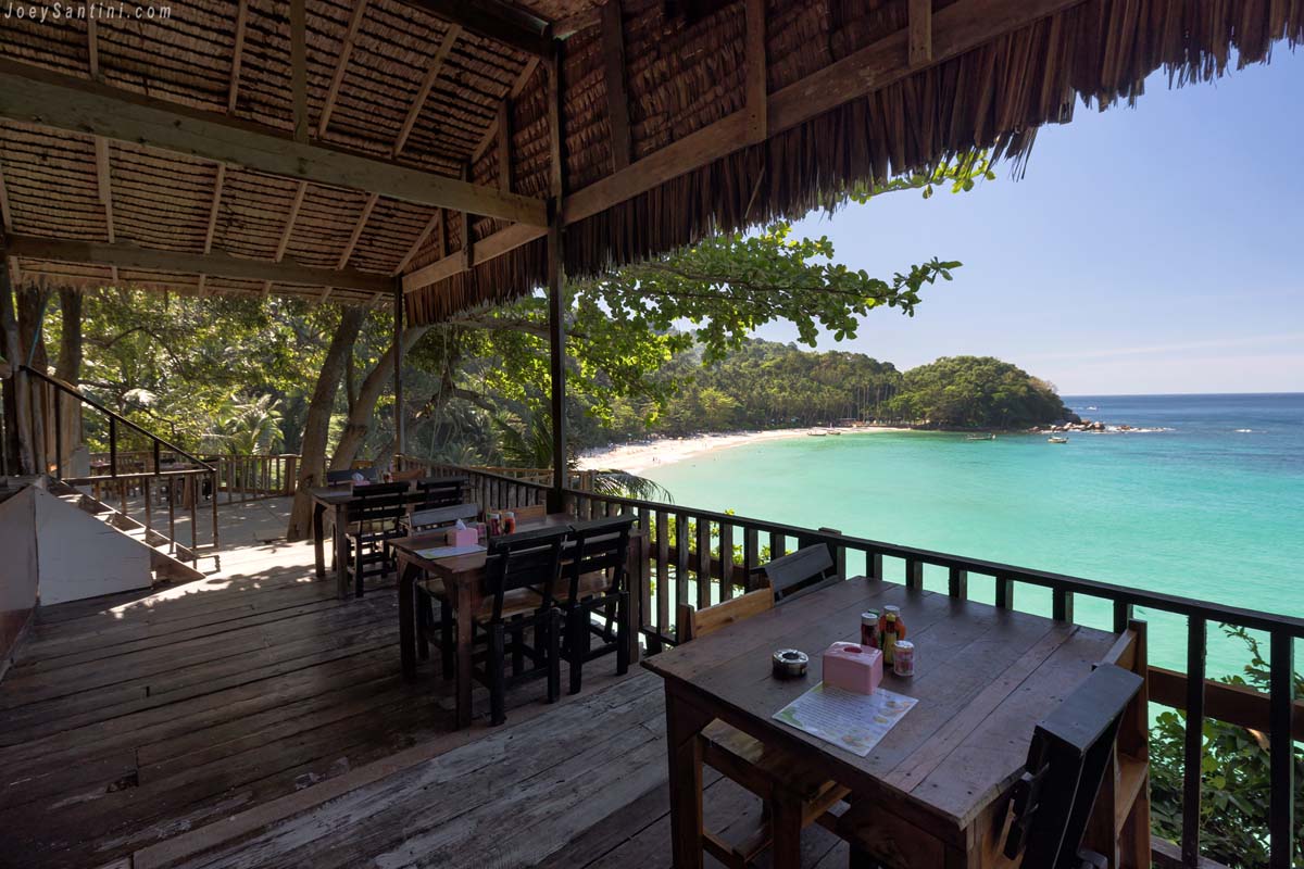Panoramic sea view from the wooden dining terrace of a local Thai restaurant on the hill of Freedom Beach.