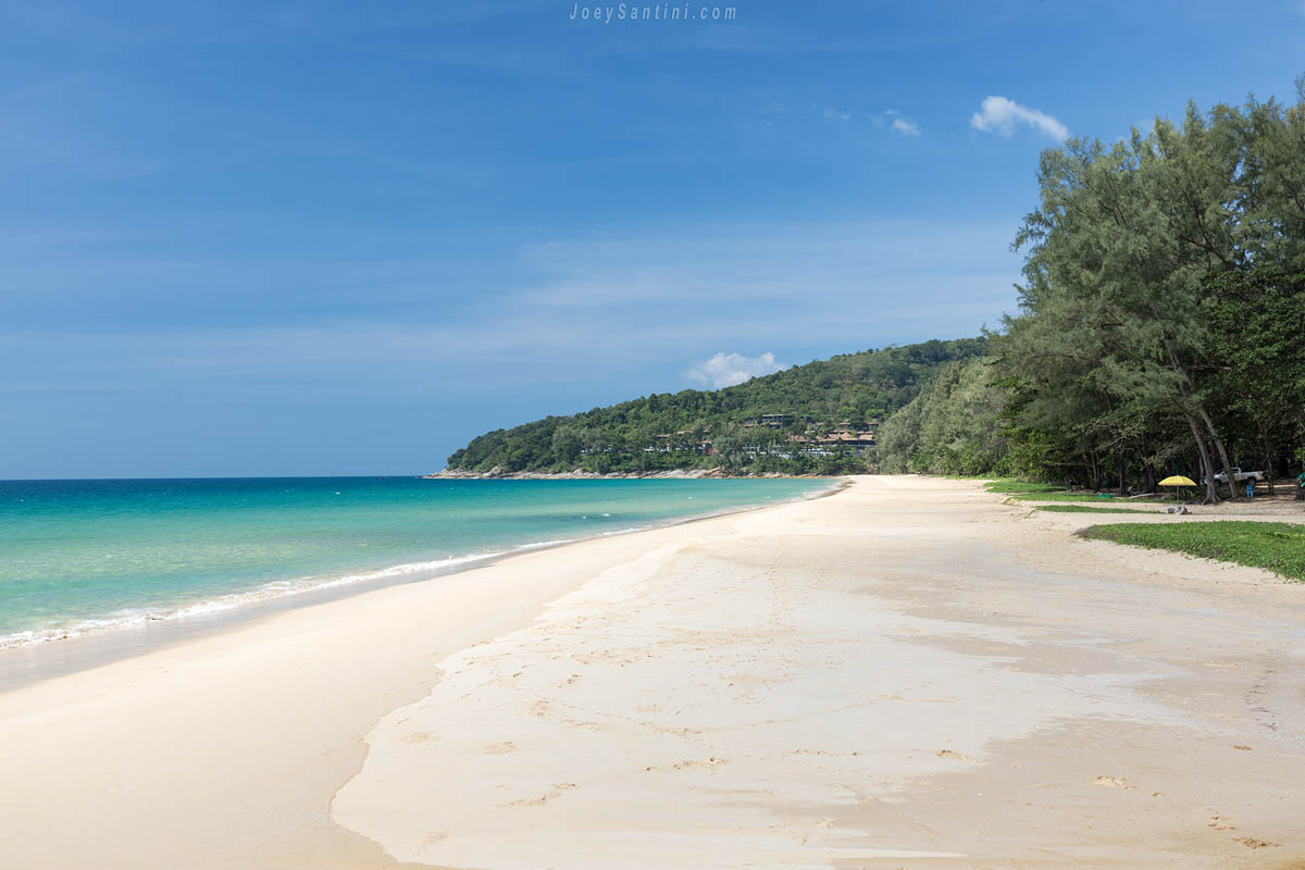 Shot of the white sand of Naithon beach with blue seas and blue sky in the background