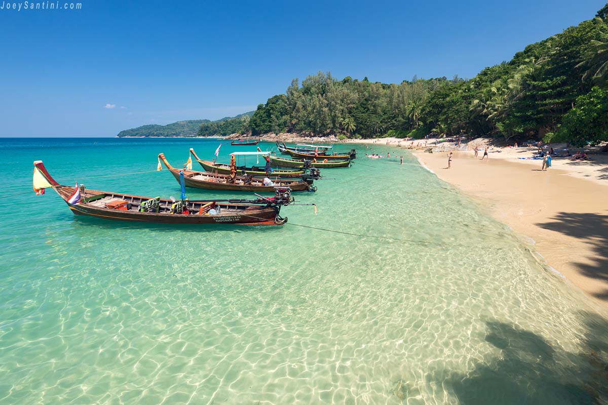 Shot of the many boats with clear water of Banana beach