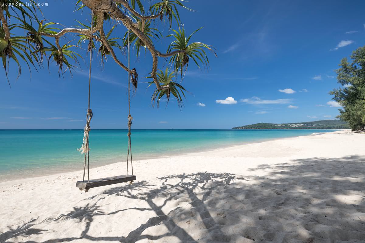 Shot of the swing on Bangtaob beach with white sand and clear blue waters