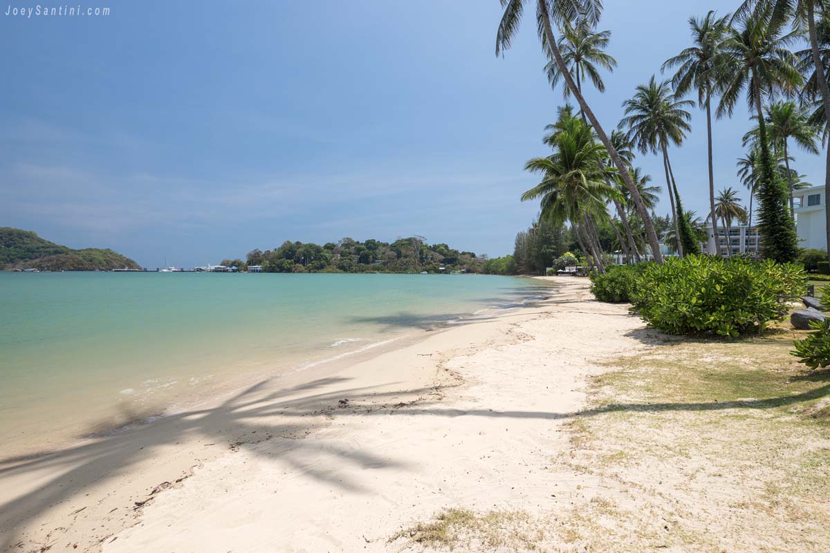 Shot of the entire Makham beach with white sand and blue sky in the background