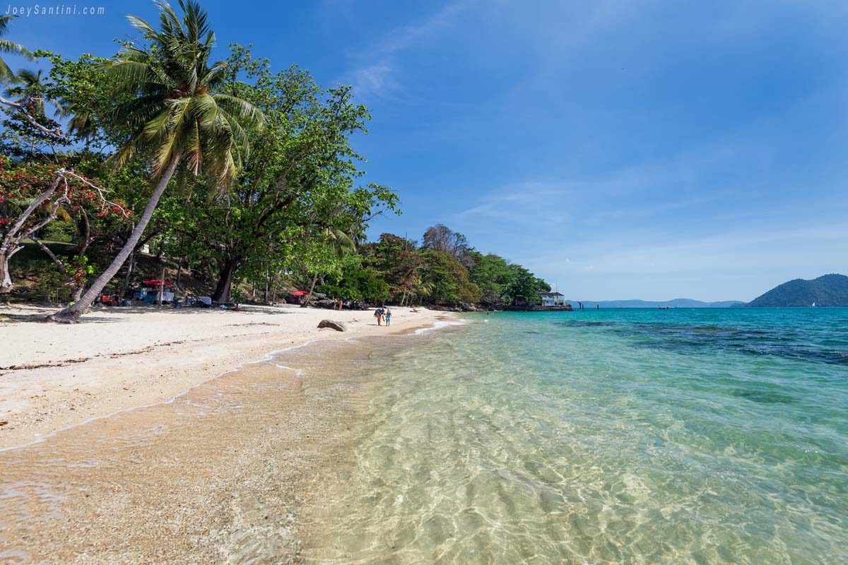 Shot of the clear water and white sand of Laem Ka Beach