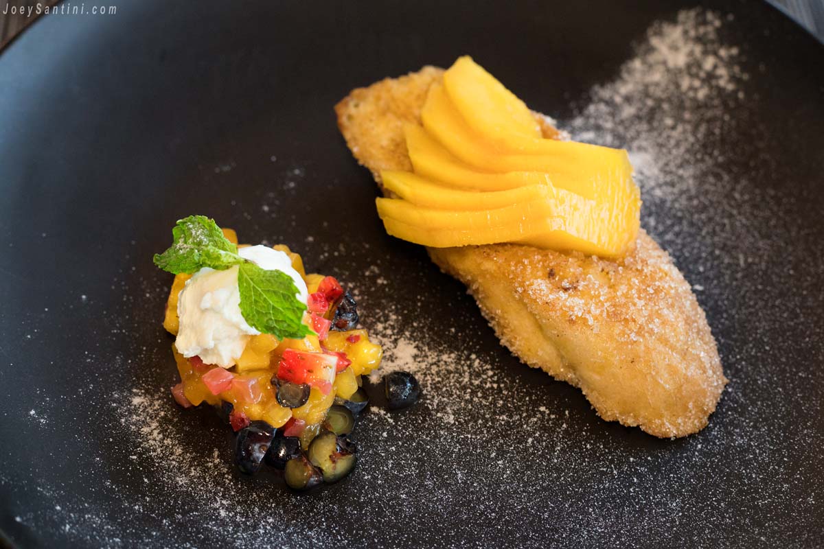 Shot of a Cinnamon French toast with Coconut apple, mango, mulberries and vanilla mascarpone.