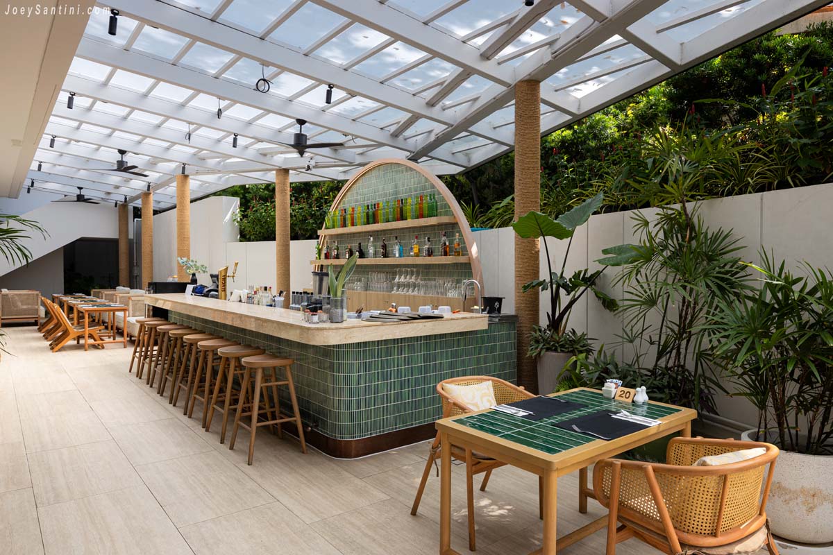 Open-air Ozone Bar with green tiled counter at Andaman Beach Hotel Phuket