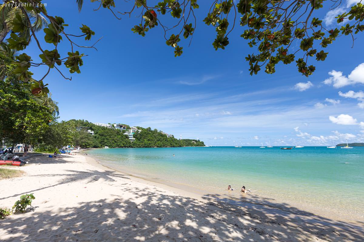 Shot of white sand and blue sea waters of the beach