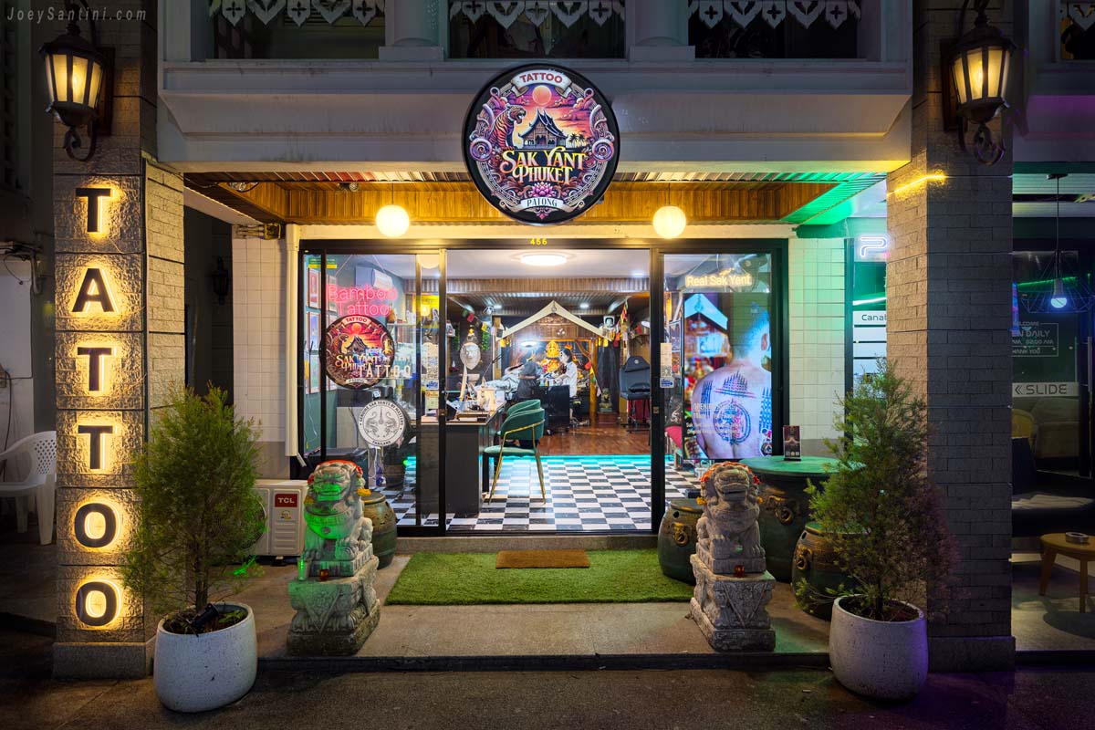 Show a tattoo studio entrance and orange lights