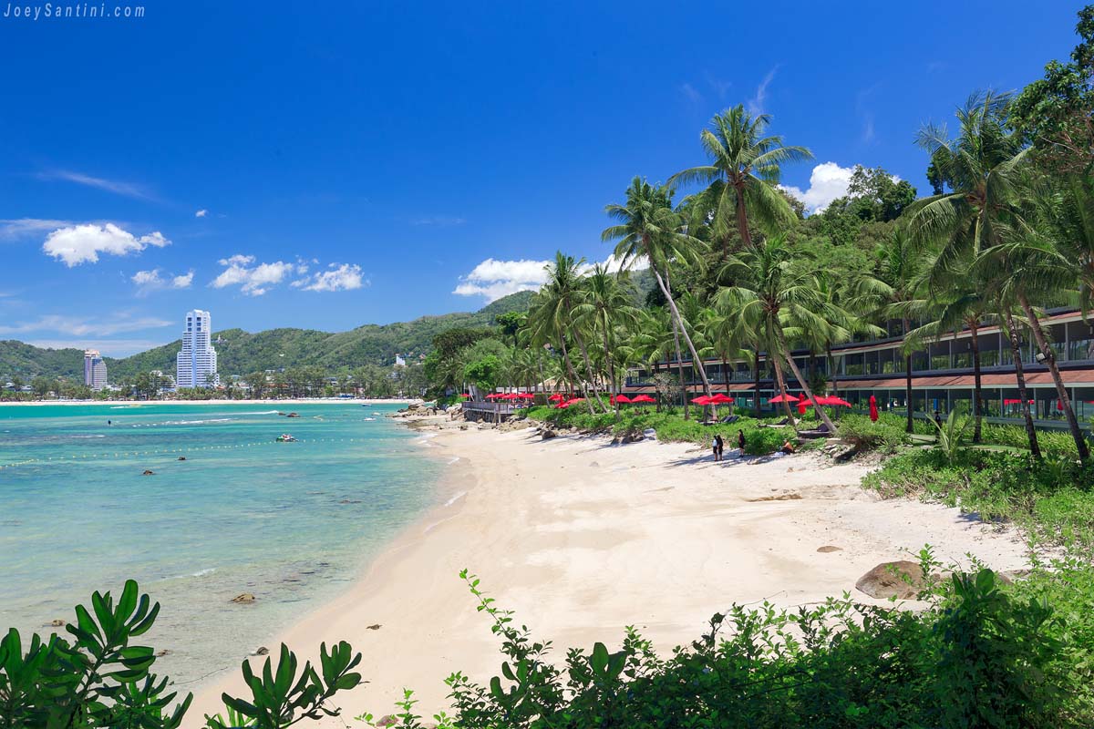 Shot of the white sand of the beach and blue sky in the background