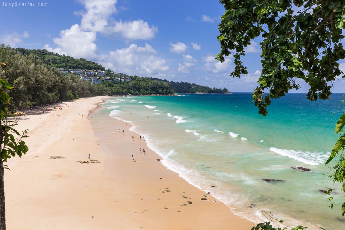 Top-down shot of Naithon Beach with blue clear waters and golden sand