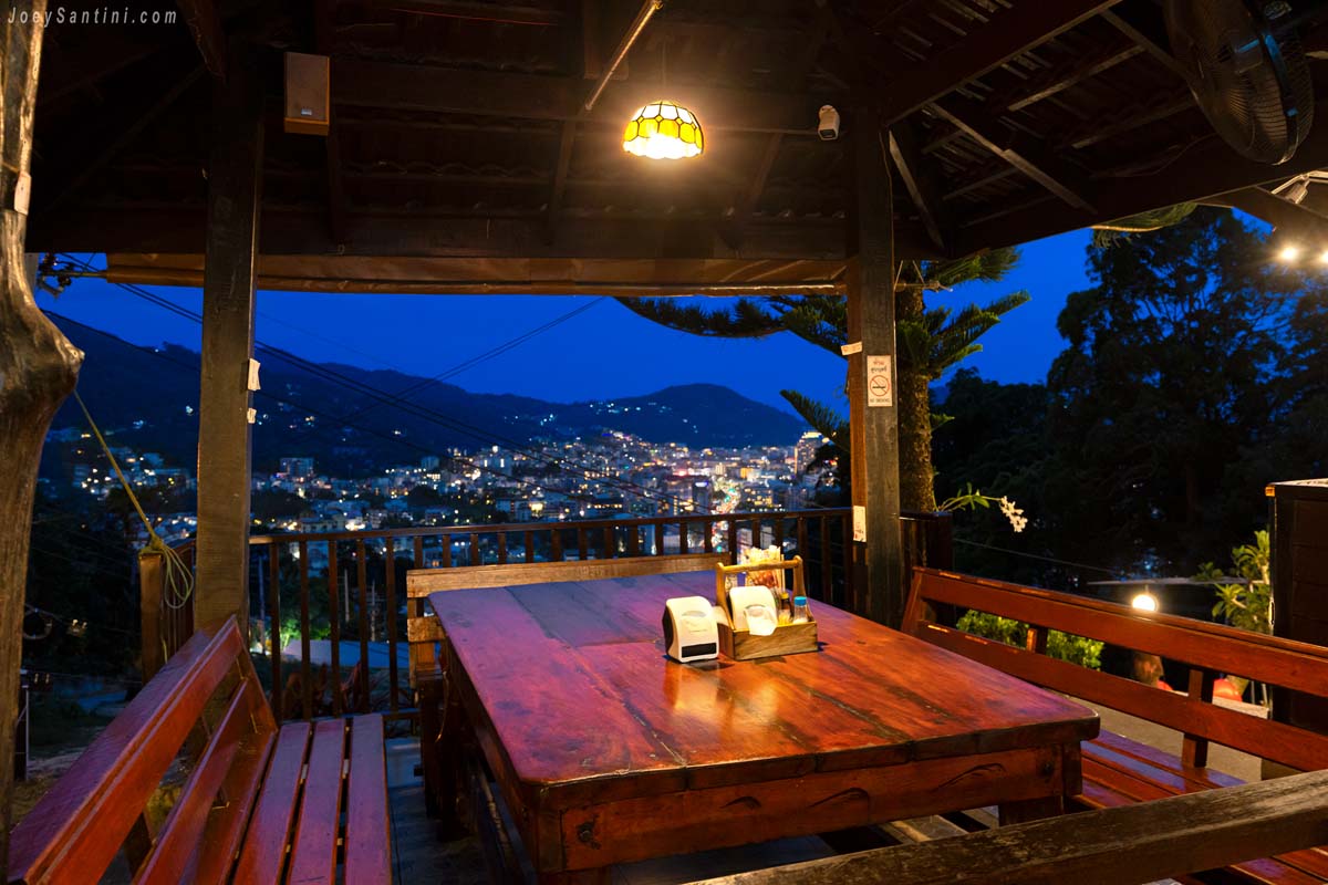 Cozy indoor seating area No 6 restaurant Patong hill wood tables