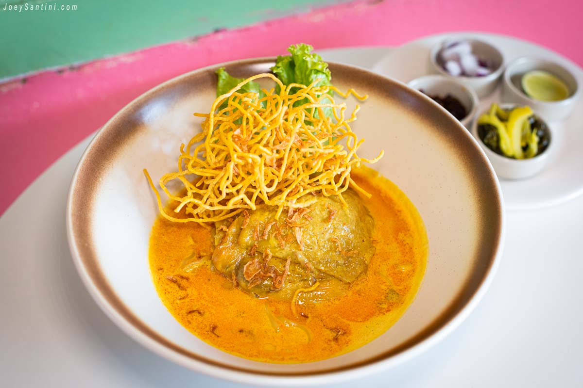 northern thai khao soi gai chicken curry noodle soup topped with crispy egg noodles at sweet come phuket