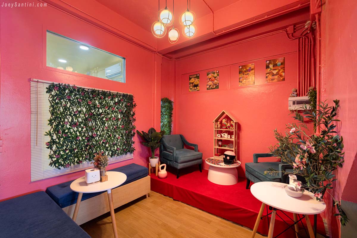 dedicated selfie photo corner with teal velvet armchairs and pink wall at sweet come phuket